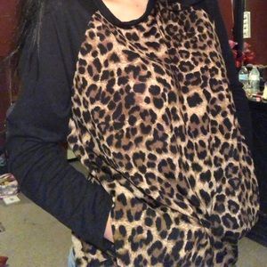 Cheetah print blouse with pockets.